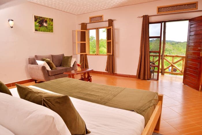 guereza canopy lodge bedroom with view